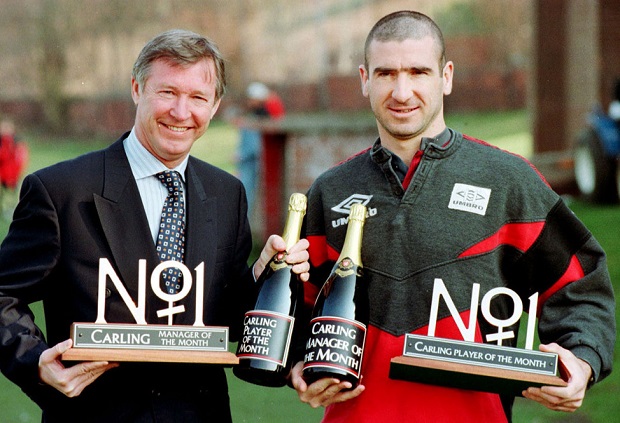 File photo dated 04/04/1996 of Manchester United's Alex Ferguson and Eric Cantona celebrating in Manchester after winning the Carling's Manager of the Month and Player of the Month respectively. PRESS ASSOCITAION Photo. Issue date: Wednesday May 8, 2013. Sir Alex Ferguson will retire at the end of this season, Manchester United have announced. See PA Story SOCCER Man Utd. Photo credit should read: Peter Wilcox/PA Wire.